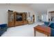 Inviting living room with vaulted ceiling, stylish furniture, and view to entryway at 4030 Crescent Walk Ne Ln, Suwanee, GA 30024