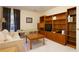 A cozy room features built-in shelves, a comfortable couch, and natural light filtering through the window at 4030 Crescent Walk Ne Ln, Suwanee, GA 30024