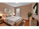 Bedroom featuring a bed, modern art, bedside tables and a large window at 4874 Seldon Se Way, Smyrna, GA 30080