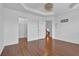 Large bedroom featuring hardwood floors, crown molding, recessed lights, closet, and a doorway to the staircase at 4874 Seldon Se Way, Smyrna, GA 30080