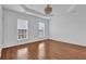 Spacious bedroom featuring hardwood floors, crown molding, recessed lights and large windows at 4874 Seldon Se Way, Smyrna, GA 30080