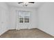 Carpeted bedroom featuring white walls and a window with white curtains at 4874 Seldon Se Way, Smyrna, GA 30080