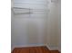 Walk-in closet featuring wire shelving and wood flooring at 4874 Seldon Se Way, Smyrna, GA 30080