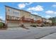 Townhome exteriors with individual garages and decks, offering modern living in a well-maintained community at 4874 Seldon Se Way, Smyrna, GA 30080