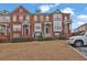 Charming townhomes with brick facades, manicured lawns, and inviting entrances at 4874 Seldon Se Way, Smyrna, GA 30080