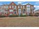 Charming townhomes featuring brick facades, manicured landscaping, and inviting front entrances at 4874 Seldon Se Way, Smyrna, GA 30080