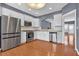 Bright kitchen with white cabinets, stainless steel appliances, granite countertops, and hardwood floors at 4874 Seldon Se Way, Smyrna, GA 30080