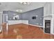 Large living space boasts gleaming hardwood floors, fireplace, and a seamless flow into the adjacent kitchen at 4874 Seldon Se Way, Smyrna, GA 30080