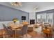 Bright living room with hardwood floors, a fireplace, stylish lighting, and comfortable seating arrangement at 4874 Seldon Se Way, Smyrna, GA 30080