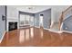 Open concept living area features hardwood floors, fireplace, and staircase, creating a welcoming atmosphere at 4874 Seldon Se Way, Smyrna, GA 30080