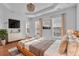 The main bedroom features hardwood floors, a chandelier, tray ceilings, recessed lights and lots of natural light at 4874 Seldon Se Way, Smyrna, GA 30080