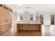 Bright, modern kitchen featuring a large center island, custom cabinets, sleek hardware, and contemporary finishes at 555 Orme Ne Cir, Atlanta, GA 30306