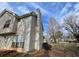Exterior facade showing neutral siding, with view of the yard, trees and sky at 738 Windsor Cir, Lawrenceville, GA 30046
