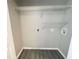 Functional laundry room with overhead shelving at 738 Windsor Cir, Lawrenceville, GA 30046