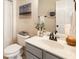 Bathroom featuring a white vanity with gray cabinets and modern fixtures and decor at 8850 Appling Rdg, Cumming, GA 30041