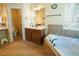 Bathroom with a soaking tub and vanity at 1092 Park Hollow Ln, Lawrenceville, GA 30043