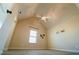 Spacious bedroom featuring a vaulted ceiling, a ceiling fan, and a window at 1092 Park Hollow Ln, Lawrenceville, GA 30043