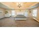 Spacious primary bedroom featuring a tray ceiling and great natural light at 1092 Park Hollow Ln, Lawrenceville, GA 30043