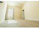 Bright bedroom featuring a window, soft carpet, and neutral walls at 1092 Park Hollow Ln, Lawrenceville, GA 30043