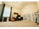 Bedroom featuring guitars, a bookshelf, a dark sofa and a window at 1092 Park Hollow Ln, Lawrenceville, GA 30043