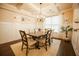 Cozy dining area showcasing elegant furnishings, complemented by wainscoting and modern lighting fixtures at 1092 Park Hollow Ln, Lawrenceville, GA 30043