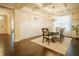 Welcoming dining area seamlessly connects to the living room, creating an open and airy atmosphere for gatherings at 1092 Park Hollow Ln, Lawrenceville, GA 30043