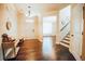 Inviting foyer with hardwood floors, staircase, and ample natural light filtering through the front door at 1092 Park Hollow Ln, Lawrenceville, GA 30043