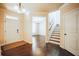 Warm foyer featuring hardwood flooring, staircase leading upstairs, and a bright and airy ambiance at 1092 Park Hollow Ln, Lawrenceville, GA 30043