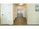 Hallway view leading to a bedroom showcasing neutral walls and plush carpeting at 1092 Park Hollow Ln, Lawrenceville, GA 30043