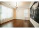 Bright living room with hardwood flooring and large windows providing ample natural light with neutral paint at 1092 Park Hollow Ln, Lawrenceville, GA 30043