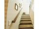 Stairway featuring carpeted steps and a wooden railing at 1092 Park Hollow Ln, Lawrenceville, GA 30043