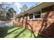 Brick home exterior with green grass and a unique patio at 1415 Dalewood Ne Dr, Atlanta, GA 30329