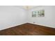 Well-lit bedroom showcasing hardwood flooring and a stylish chandelier fixture at 1415 Dalewood Ne Dr, Atlanta, GA 30329