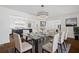 Elegant dining room featuring modern lighting, stylish decor, and open view to kitchen at 1415 Dalewood Ne Dr, Atlanta, GA 30329