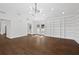 Bright living room features a vaulted ceiling, hardwood flooring, and built-in shelving at 1415 Dalewood Ne Dr, Atlanta, GA 30329