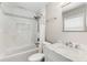 Bright bathroom featuring marble tile, modern fixtures, and a shower over the tub at 2941 Foothill Trl, Marietta, GA 30066