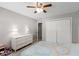 Bedroom with carpet, ceiling fan, and a large closet at 2941 Foothill Trl, Marietta, GA 30066