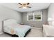 Cozy bedroom with carpet, ceiling fan, and large window at 2941 Foothill Trl, Marietta, GA 30066