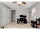 Bedroom featuring ceiling fan, carpet flooring, closet and window, with desk at 2941 Foothill Trl, Marietta, GA 30066