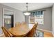 Bright dining room with hardwood floors, wooden table, and view into the living space at 2941 Foothill Trl, Marietta, GA 30066