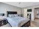 Cozy bedroom featuring carpet, neutral walls, and a view to the bathroom at 5545 Circlestone Ln, Stone Mountain, GA 30083