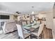 Open-concept dining area and adjacent kitchen provides an ideal space for Gathering dining and entertainment at 5545 Circlestone Ln, Stone Mountain, GA 30083