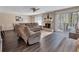 Cozy living room with fireplace, ceiling fan, and comfortable seating area, perfect for relaxing at 5545 Circlestone Ln, Stone Mountain, GA 30083