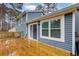 A spacious wooden back deck with sliding glass door and outdoor living at 1341 Inman Ct, Norcross, GA 30093