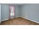 Cozy bedroom with neutral paint, carpet, and natural light from the window at 1341 Inman Ct, Norcross, GA 30093