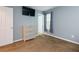 Bedroom featuring neutral paint, carpet, a dresser, and a flat screen television at 1341 Inman Ct, Norcross, GA 30093
