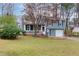 Charming two-story home with blue siding, a front porch, and a well-maintained lawn at 1341 Inman Ct, Norcross, GA 30093
