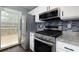 Stainless steel appliances in the kitchen, including a modern gas range and refrigerator at 1341 Inman Ct, Norcross, GA 30093