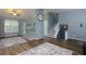Open-concept living room featuring updated flooring and a view of the staircase at 1341 Inman Ct, Norcross, GA 30093