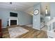 Inviting living room featuring a fireplace, modern floors, and an open layout at 1341 Inman Ct, Norcross, GA 30093